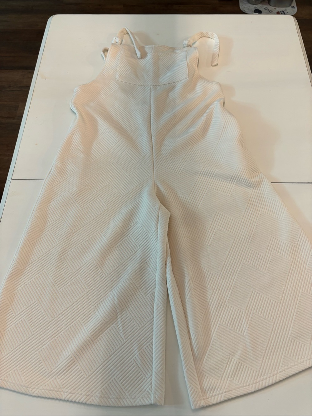 Sleeveless Cream Textured Wide-Leg Jumpsuit with Tie Straps